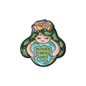 Enamel brooch with Earth Mother embracing the globe for Mother Earth Day awareness