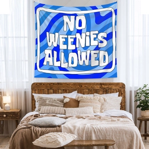 Detail showing the blue wave pattern and No Weenies Allowed text on the wall tapestry