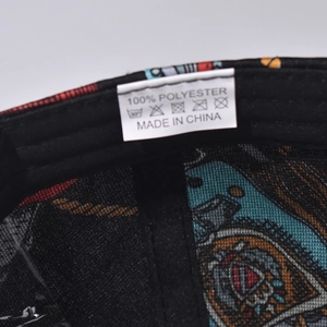 Detail view of the baseball cap's inner lining and 100% polyester care label information
