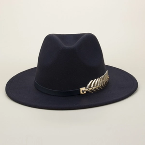 Detail of navy blue felt fedora featuring a smooth band and gold metal leaf ornament