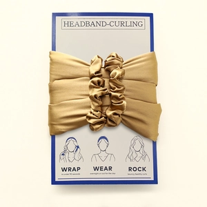 Golden silk heatless hair curler set on a display card with illustrated usage instructions