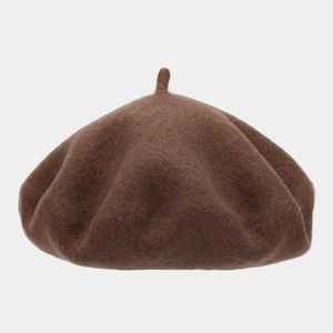 Close-up of thick dark brown wool beret showing refined felt texture and top stem detail