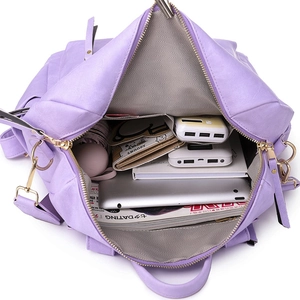 Large purple vintage backpack for women with spacious interior and metal zipper details