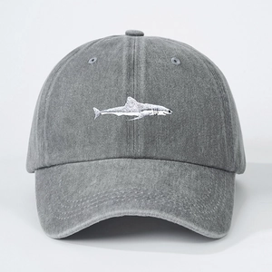 Adjustable washed cotton baseball cap in grey with white shark embroidery and vintage texture