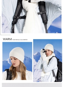 Three-piece winter set with white ribbed knit hat, scarf, and touchscreen gloves in snow