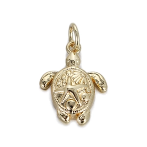 Detailed view of a golden turtle pendant with starfish pattern and metallic luster