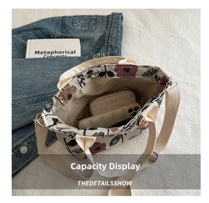 Interior view of floral jacquard tote bag showing storage capacity for phone and wallet