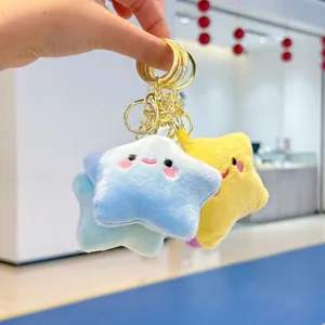 Cute plush star keychain with smiley face embroidery in blue, yellow and purple