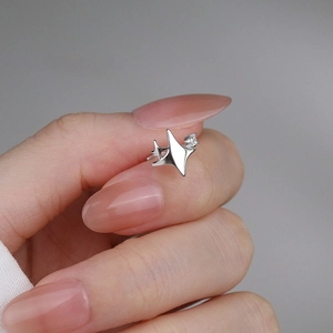 S925 sterling silver star ear cuff with sparkling zircon held between fingers