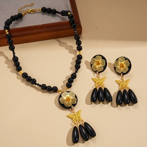Gothic beaded flower butterfly necklace and earrings set with gold-tone accents