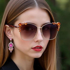 Fashion cat-eye sunglasses with rhinestone metal frame and matching gem drop earrings