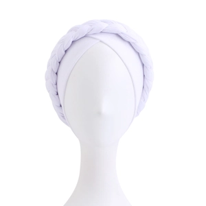 Close-up of white braided turban headwrap showing detailed knit texture and elastic fabric