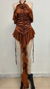 Detail of caramel ruffled halter dress featuring handcrafted 3D rose and satin finish