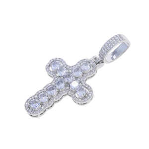 Detailed close-up of a silver hollow cross pendant set with sparkling zircon stones