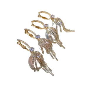 Sparkling gold cubic zirconia hoop earrings with tassel charms and pearl detail