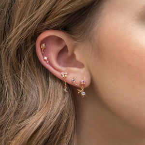 18K gold plated zircon earring set with star moon and rabbit charms on female model