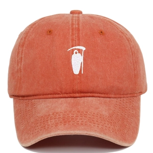 Detail shot of Grim Reaper white embroidery on vintage washed cotton baseball cap