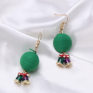 Detailed view of Christmas wreath earrings with thread balls and enamel bells on silk