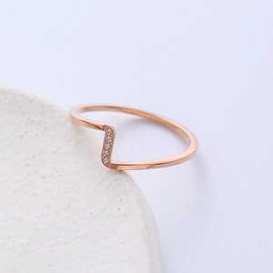 Wave-shaped rose gold ring for women with vertical set cubic zirconia gemstones
