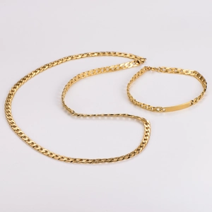 Detailed view of gold plated flat Cuban link chain set with engravable rectangular bar