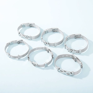 Detailed view of six silver mesh bracelets with various charms on a blue background