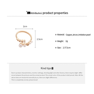 Detailed dimensions of gold-plated ring with zircon and imitation pearls on a white background