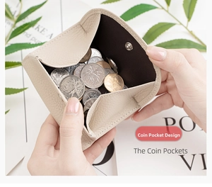 Macro detail of beige leather coin pocket with metal snap button and interior storage
