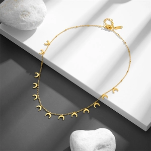 Minimalist stainless steel necklace featuring multiple crescent moon pendants in gold finish