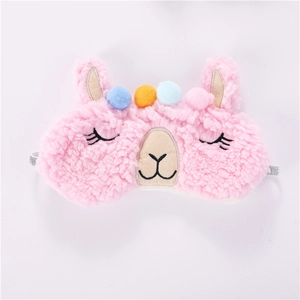 Detail of pink plush alpaca sleep mask with colorful pom-poms and silver elastic band