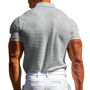 Rear view of men's grey waffle knit polo shirt showing textured fabric and fit on model