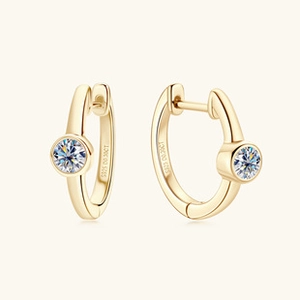 Close-up of S925 sterling silver gold earrings with 0.30ct moissanite stones