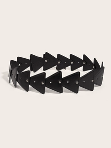 Detailed view of black PU leather belt with triangular panels and metallic rivet studs