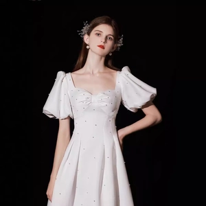 Elegant French white satin dress with puff sleeves and pearl accents for engagement