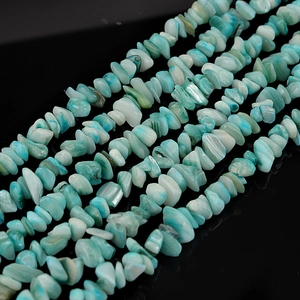 Macro detail of irregular turquoise shell chips for DIY jewelry making and crafts