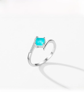 Detail of S925 silver ring featuring a square Paraiba tourmaline stone and side zircons
