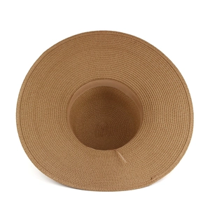 Women's summer straw sun hat with wide brim and woven texture in dark beige color