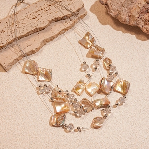 Multilayer irregular shell bead necklace with iridescent mother of pearl and crystals