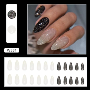 Sparkly almond press-on nails set in dark glitter and translucent white shimmer