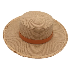 Flat top raffia sun hat with frayed edges and brown leather band for beach vacations