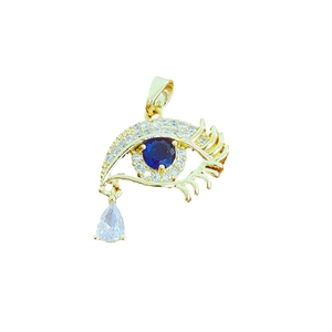 Golden evil eye pendant with deep blue gemstone and teardrop diamond charm