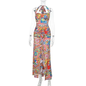 Detailed front view of halter neck printed dress with tiered ruffles and side slit design