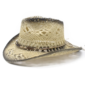 Detail of retro straw cowboy hat with hollow knit patterns and beaded ethnic band
