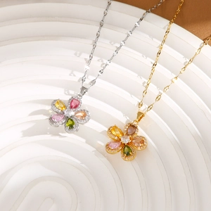 Detailed macro view of a floral pendant necklace with colorful zircon stone settings