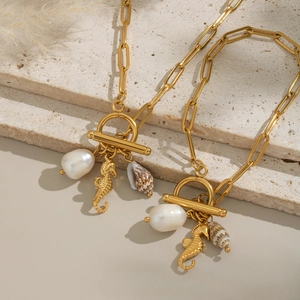 18K gold plated ocean necklace with sea horse, pearl and shell charms on paperclip chain
