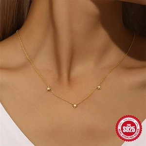 Elegant S925 sterling silver gold necklace with star charms and pearls on a model