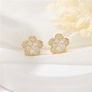 Elegant camellia stud earrings with white enamel petals and 14k gold plated frame