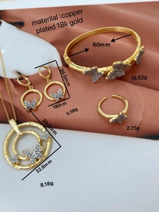 Detailed view of 18K gold plated butterfly jewelry set with precise measurements
