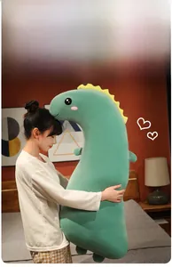 Detail of long dinosaur plush body pillow showing soft fabric and large scale display