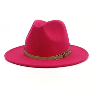 Detail of fuchsia fedora hat with brown leather band and gold buckle on wool felt