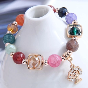 Colorful beaded Tree of Life charm bracelet featuring faceted crystals and gold accents